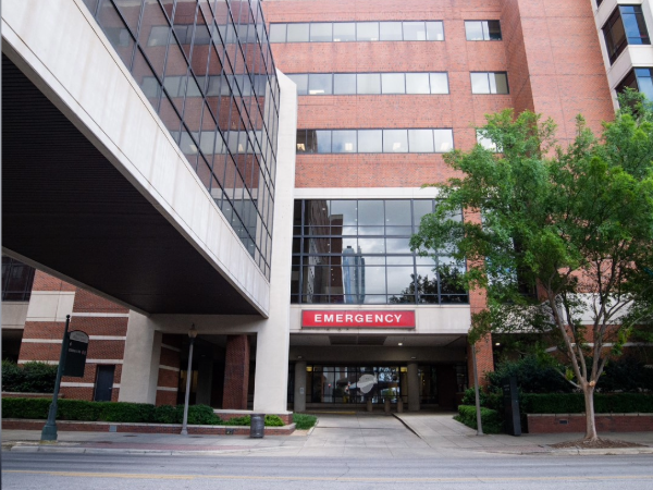Outside view from the street in downtown Birmingham looking at the Emergency department sign and entry