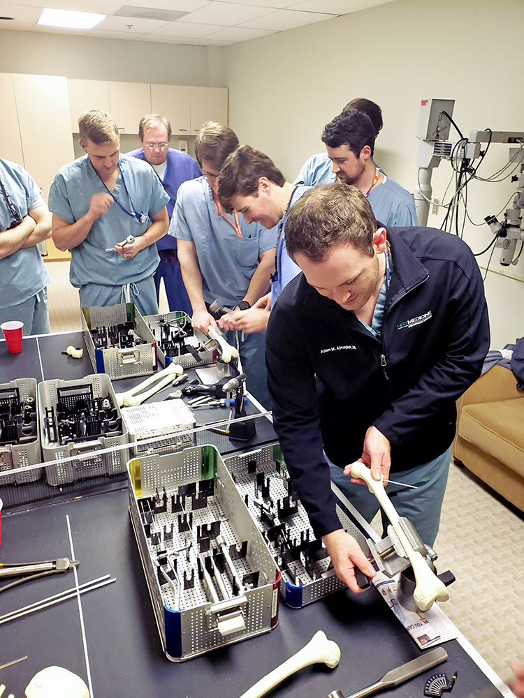 Orthopaedic surgery residents practice femoral osteotomies and spinopelvic fixation as part of a Sawbones lab.