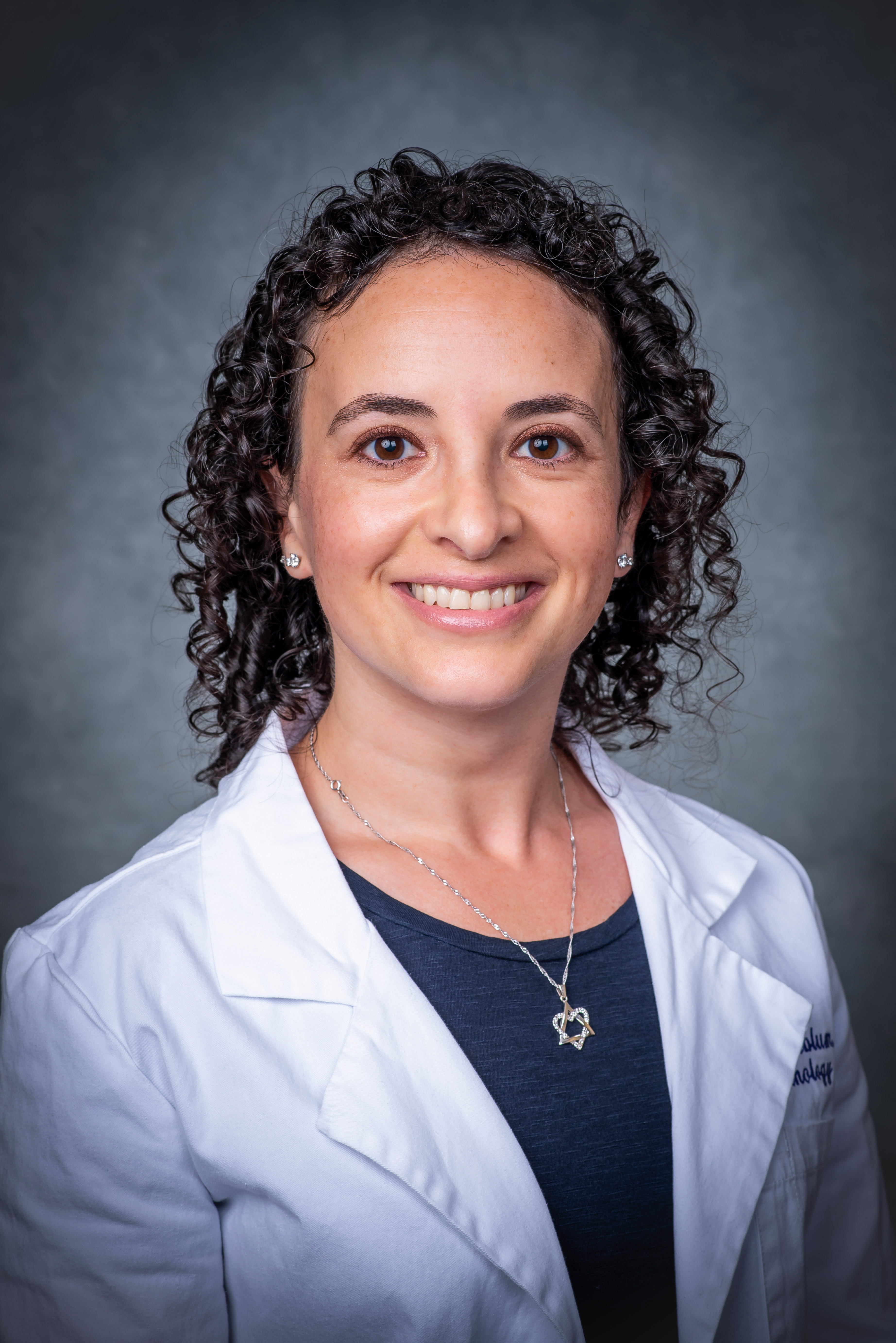 Head shot of Dr. Frida Rosenblum Donath, MD (Assistant Professor, Anatomic Pathology) in white medical coat, 2018.