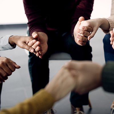 Close-up of people holding hands 