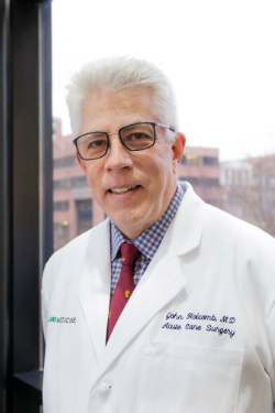 Holcomb, John B., M.D.