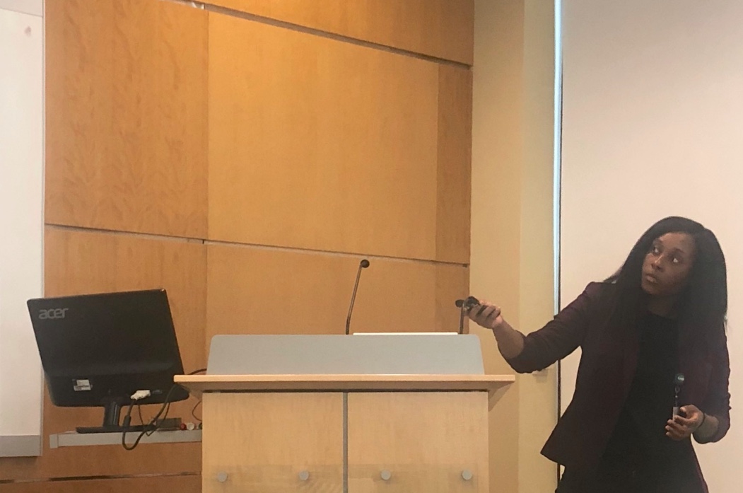 University of North Carolina in Charlotte and UAB SURE student Symonne Martin discusses the breast cancer research she performed under the mentorship of Dr. Rachael Lancaster and Dr. Catherine Parker this summer at the PRISM and SURE presentation reception in Wallace Tumor Institute 101 on Thursday, July 26, 2018.