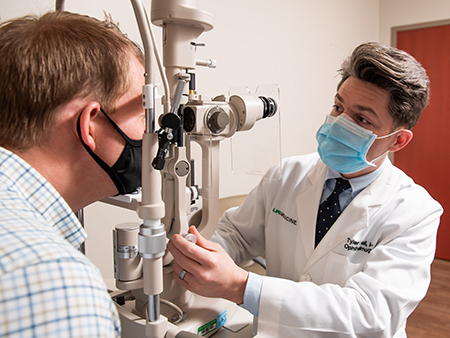 Doctor examining patient's eyes. 