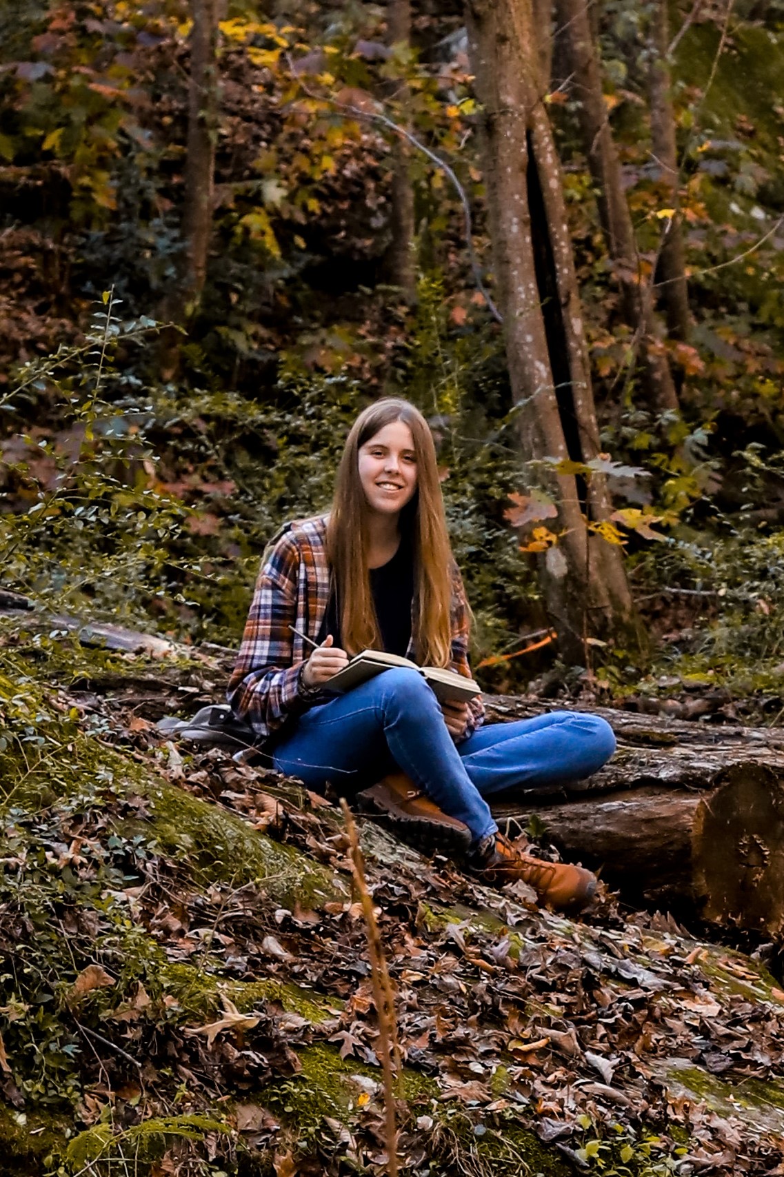 Amelia sitting in the woods