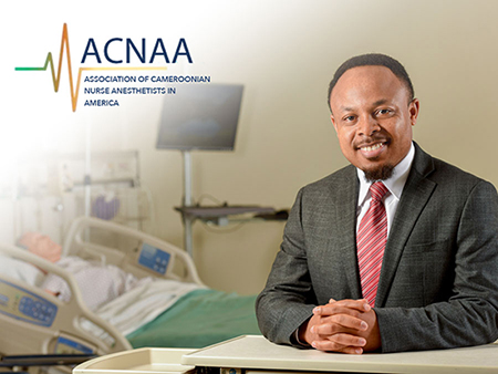 Image of Edwin Aroke, Ph.D, sitting at table. 