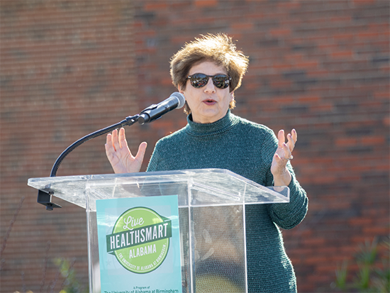 Woman speaking on podium. 