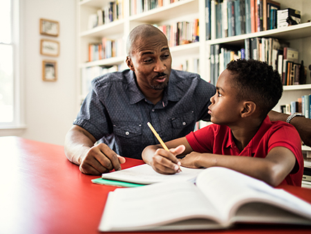 Father helping son with homework