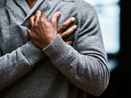 Cropped shot of an unrecognizable senior man holding his chest in pain