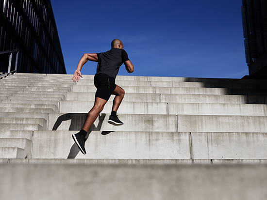 Man running up stairs