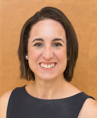 Head shot of Dr, Jodie Dionne-Odom, MD (Assistant Professor, Infectious Diseases) in white medical jacket (2013).