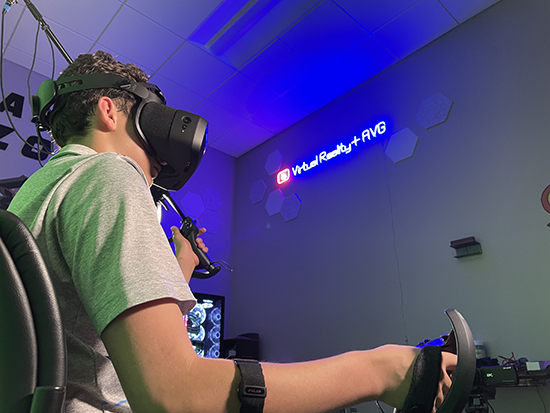 Child sitting in chair with virtual reality headset on