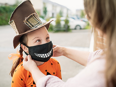 Little girl getting ready for Halloween