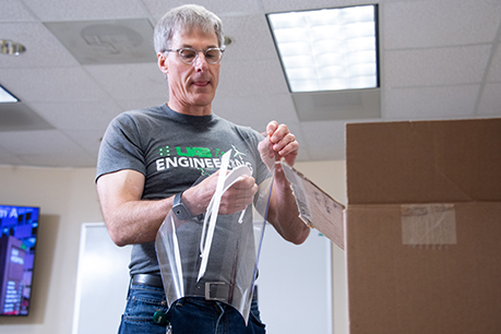 Tim Wick, UAB Engineering, putting together a prototype face shield