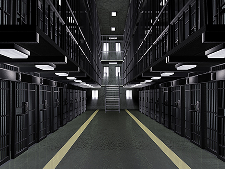 Dutch angle view looking up at the empty cells in a multi-tiered prison