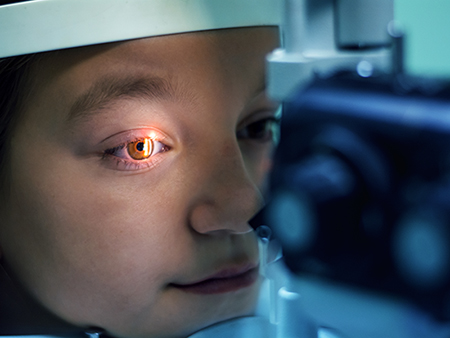 Optometrist performing visual field test