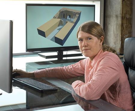 Dr. Sarah Parcak, PhD (Associate Professor, Anthropology) is sitting at desk in her office, 2017.