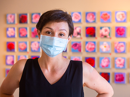 Artist Amy R. Peterson stands in front of the "Peony Project." 