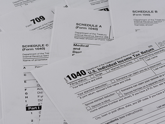 Various pages of the US IRS tax return forms with business tools