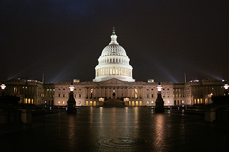 The dome of the United States Capitol lit at night in Washington, DC.