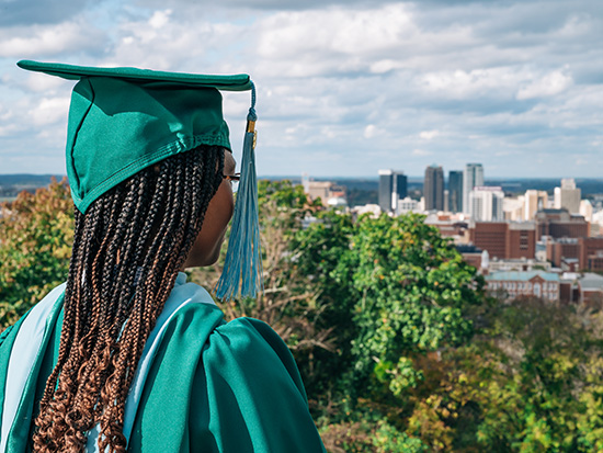 Nakia Coleman looking out at the Birmingham city skyline.