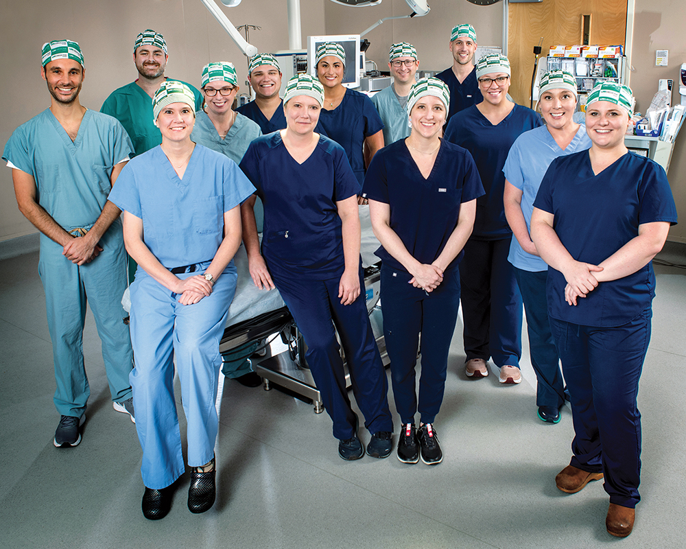 Photo of UAB's Xenotransplant team. (From left, front row: Jayme Locke, M.D., Katie Stegner, Lindsey Banks, Amy Johnson, M.D., Sara Macedon;Back row: Babak Orandi,M.D., Ph.D., Jordan Lee, M.D., Paige Porrett, M.D., Ph.D., Brett Findley, Natalie Anderson, Drew Shunk, M.D., JennyAnn Eads)