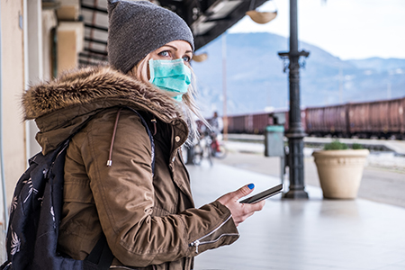 Caucasian Woman waring Face Mask on the Station; Slovenia on the border with Italy, Europe.