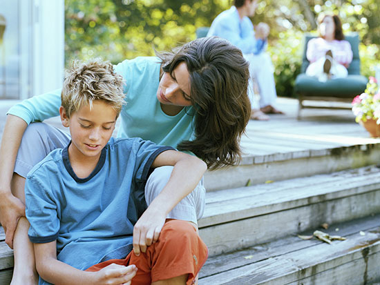 mother sitting with son ts