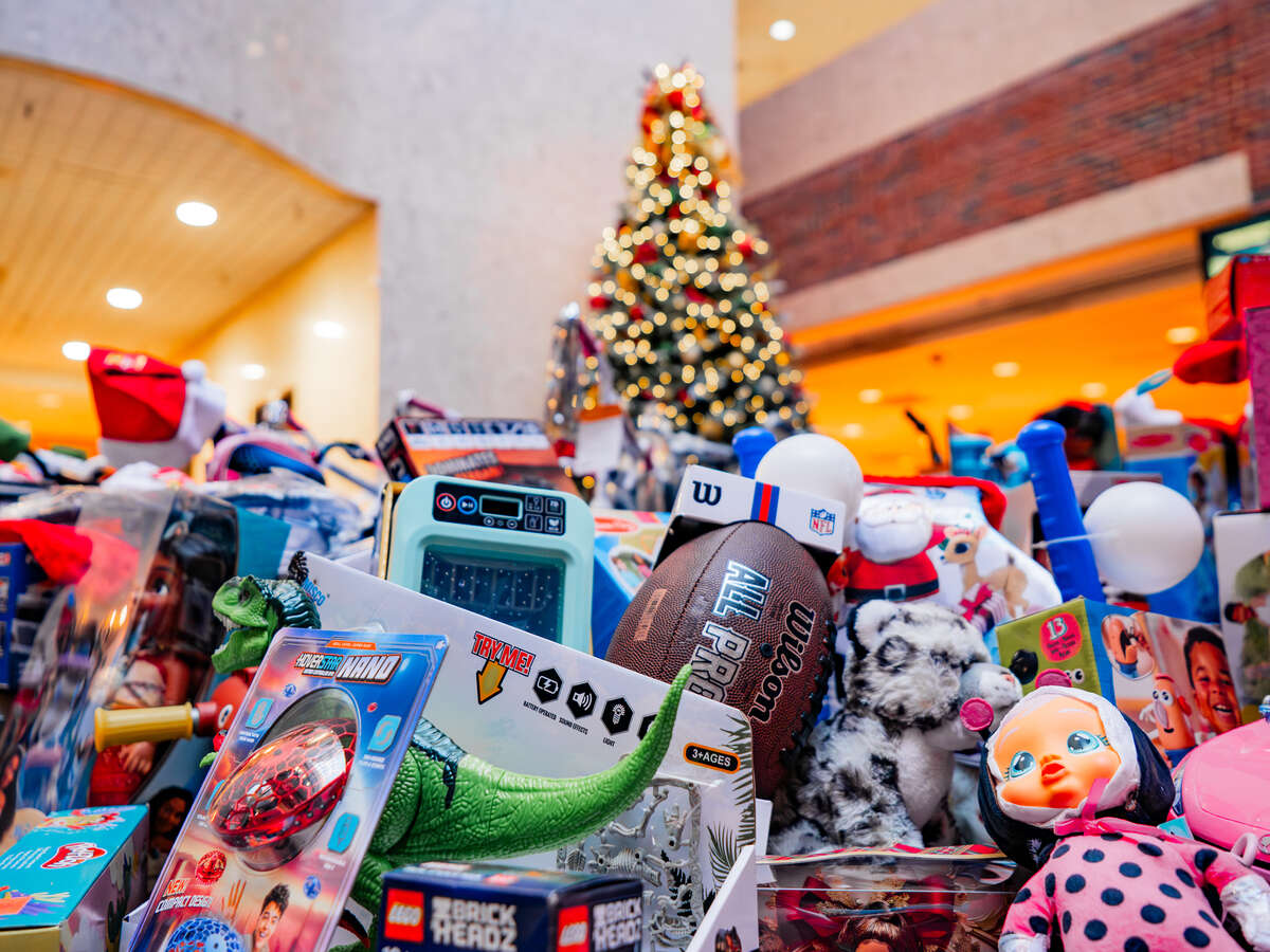 Close-up of donated toys on display near a Christmas tree in the West Pavilion during the U.S. Marine Corps' Toys for Tots UAB Toy Drive on display.
