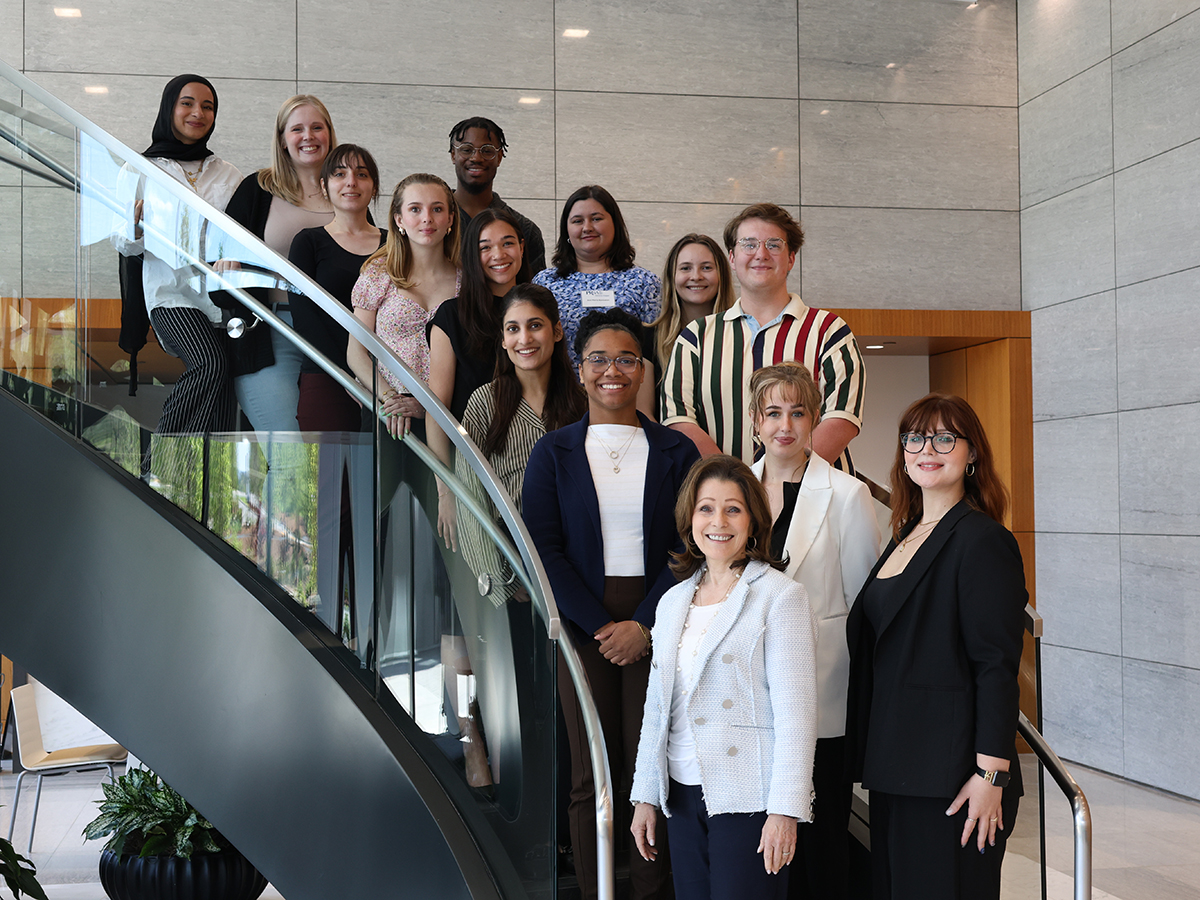UAB Public Relations students and faculty posing on a staircase. 