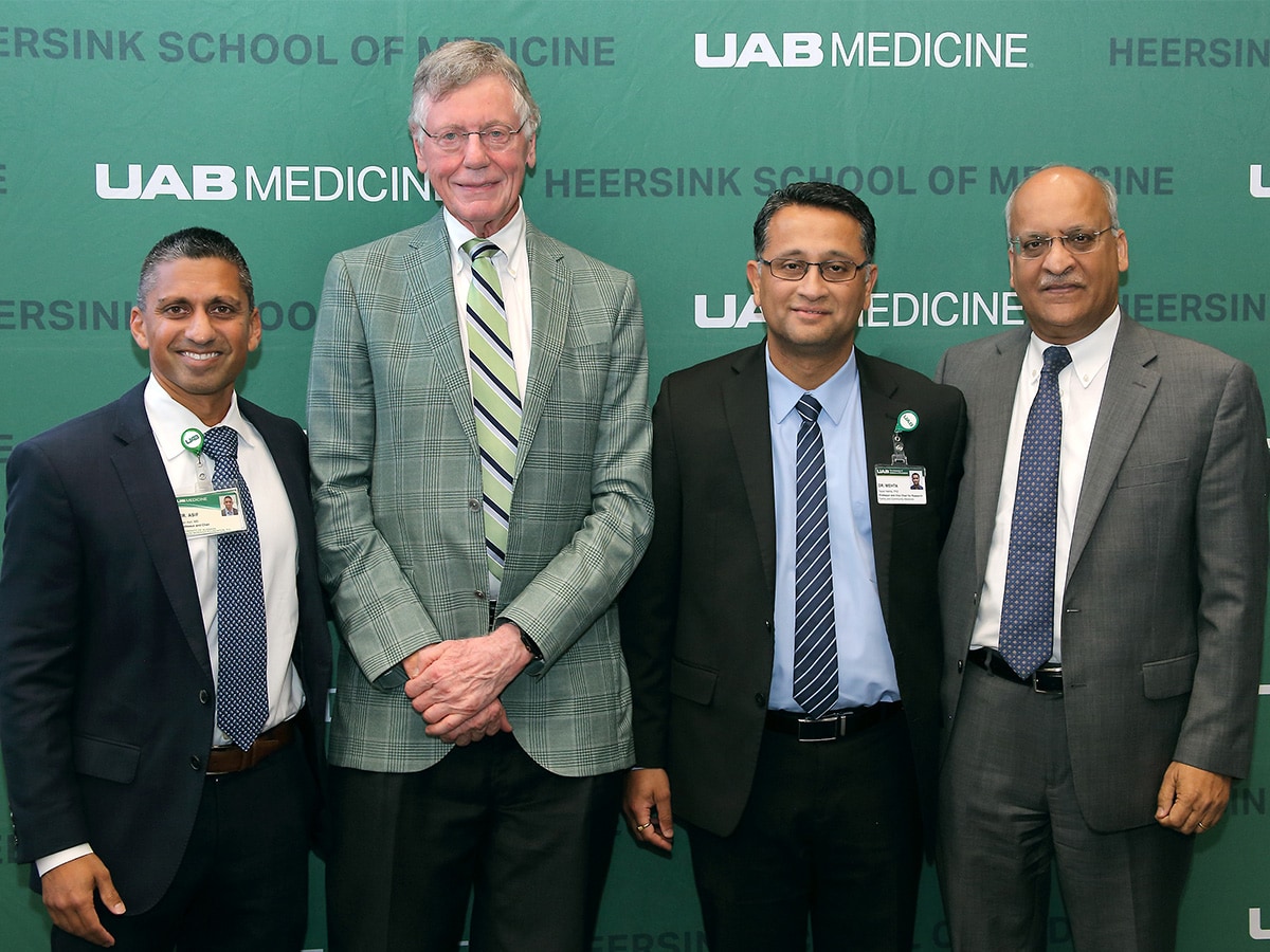Irfan Asif, M.D., Marnix E. Heersink, M.D., Tapan Mehta, Ph.D., and Anupam Agarwal, M.D., standing against a green UAB Medicine backdrop.