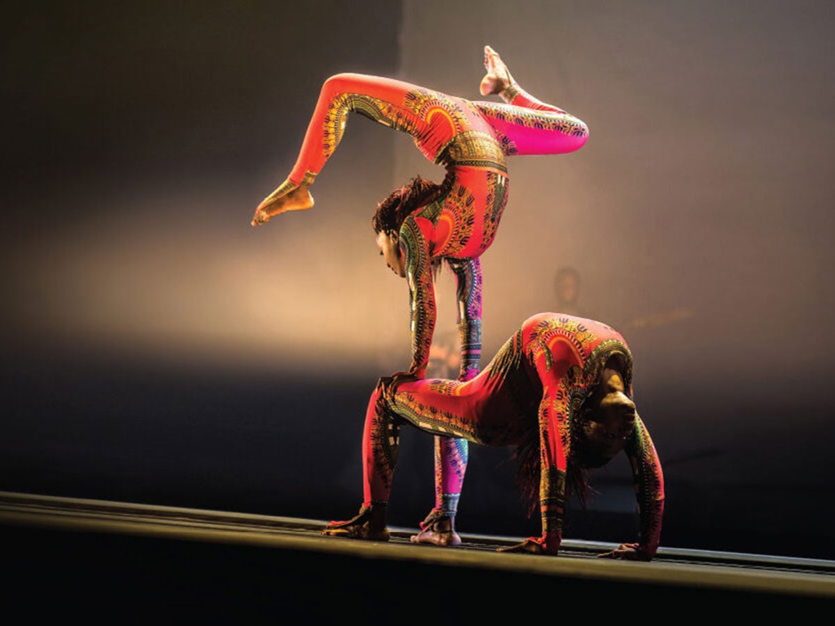  Two Cirque Kalabanté acrobats performing on stage