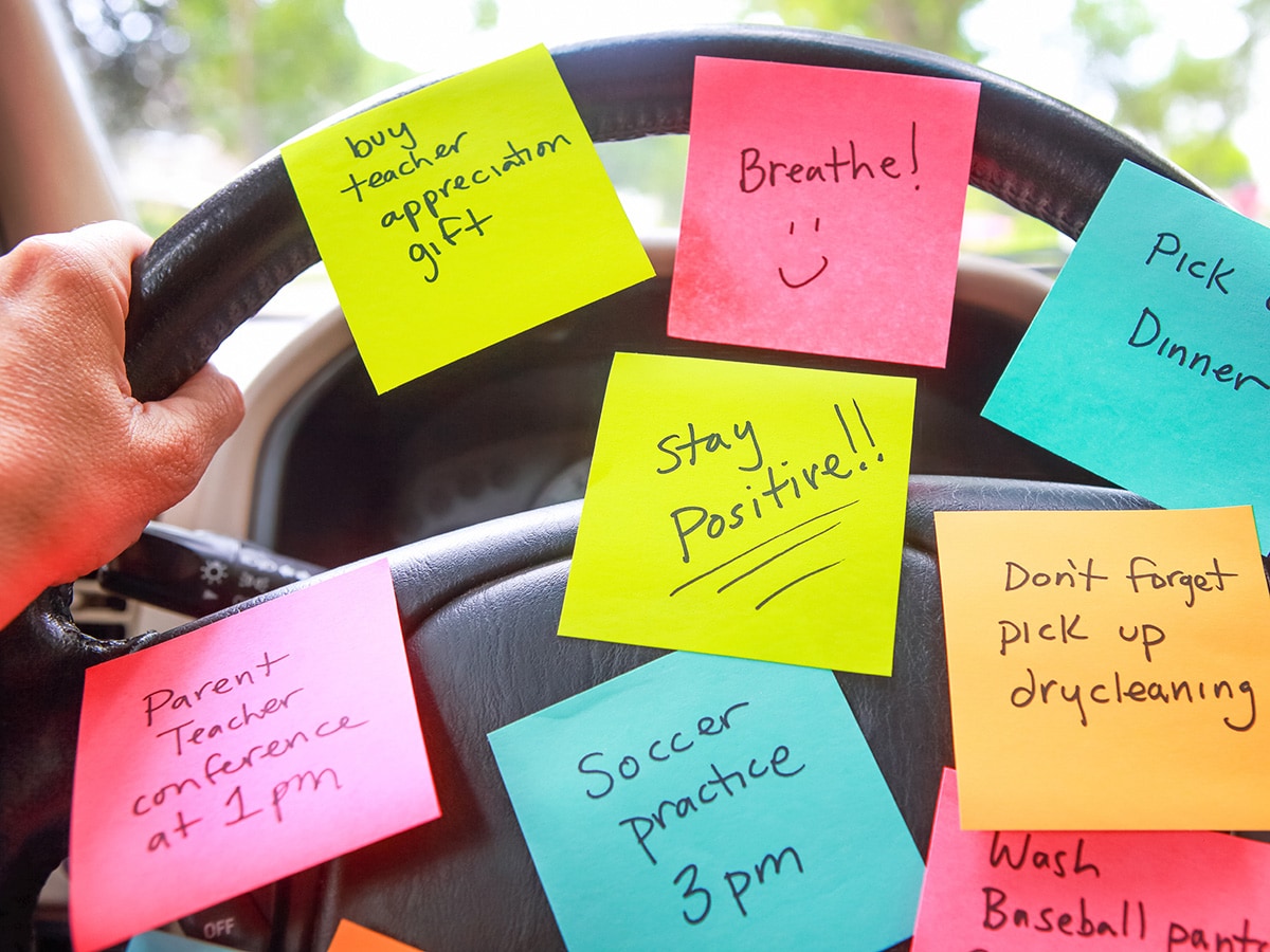 Errand sticky notes on steering wheel.