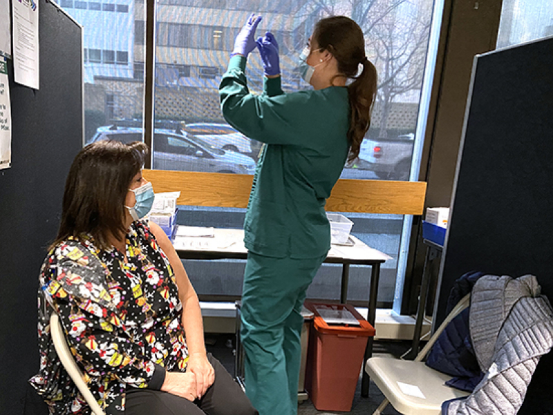 Third-generation nurse vaccinates mother, carries on tradition of service