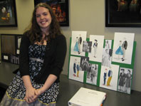 Graduate Amanda Mattes with some of her designs.