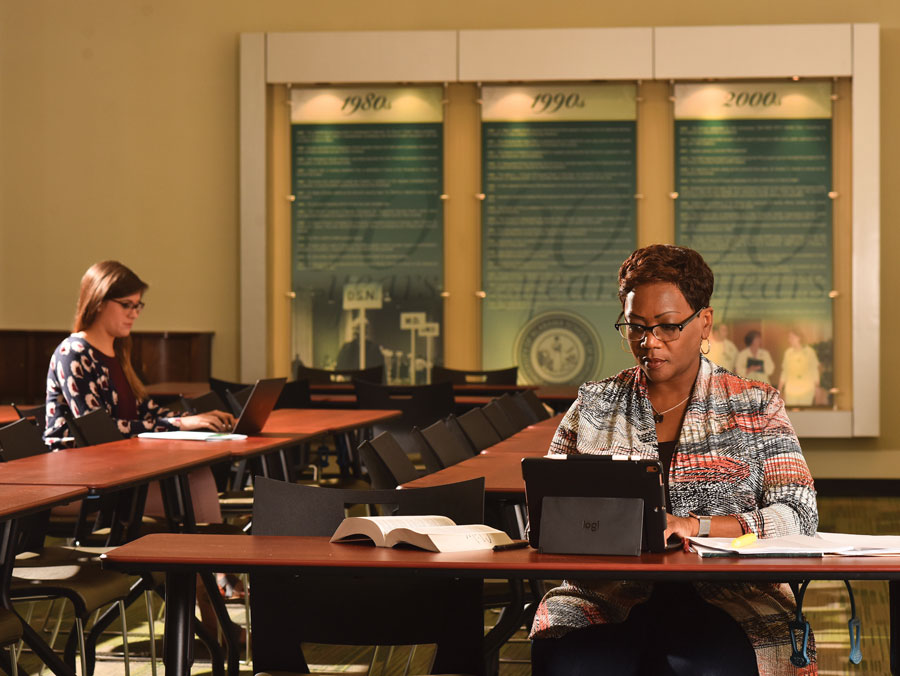 Photo: Gwen Childs  writing on laptop
