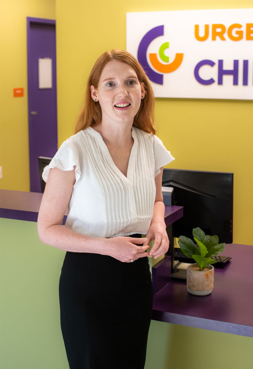 Emily smiling in the Urgent Care for Children clinic