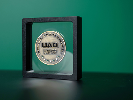 UAB patent coin in case