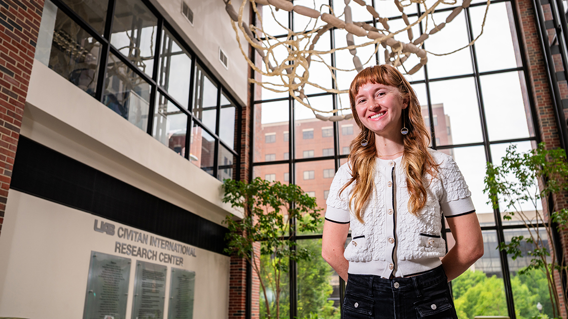 Ava Piper in the lobby of the Civitan International Research Center building on UAB's campus