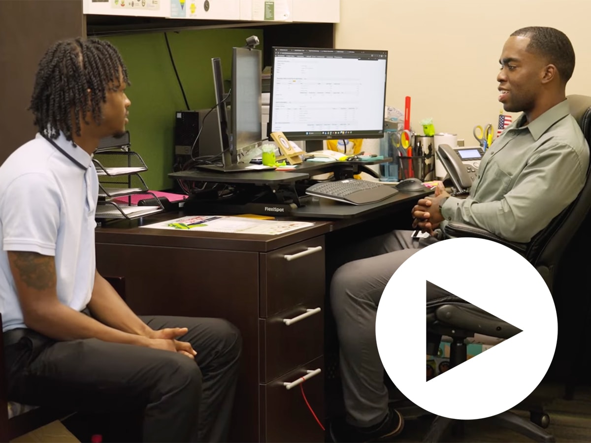 Demarcus Davis speaks with a member of Veteran Services at UAB