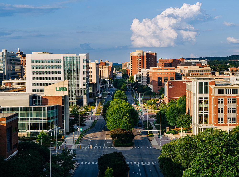 Drone photo looking east down University Boulevard shows U A B buildings on either side of the street and clouds above