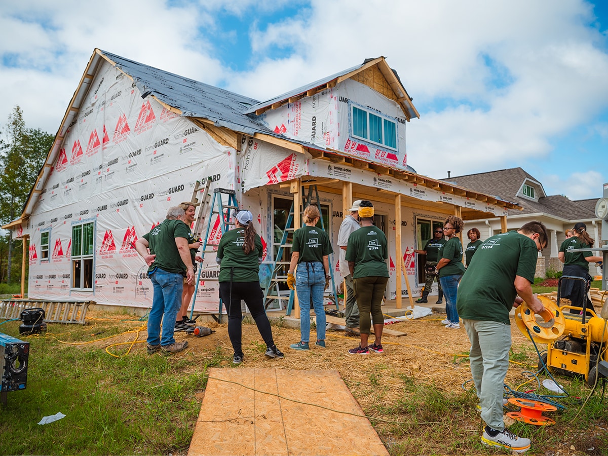 Volunteers working on a Habitat for Humanity build