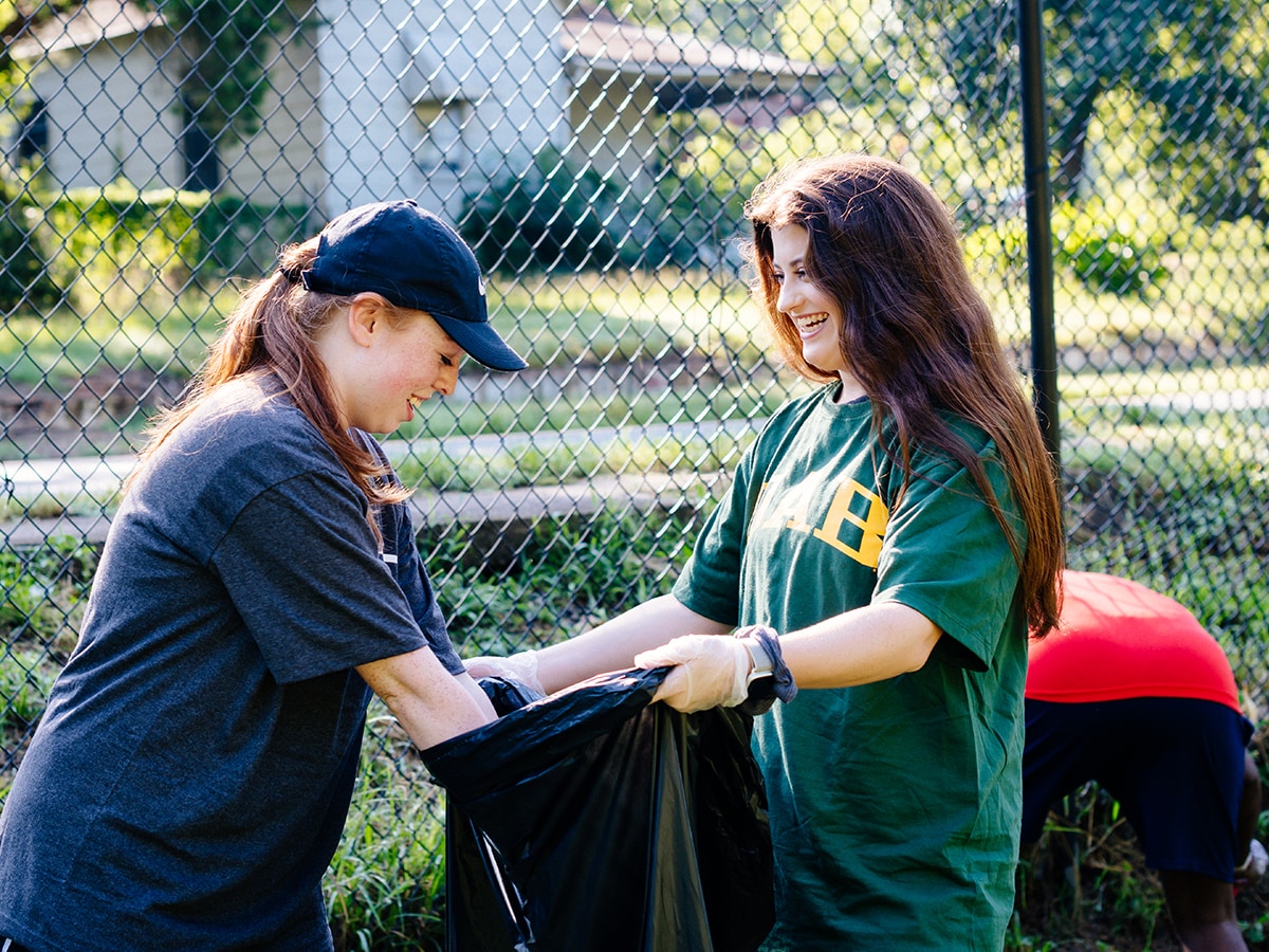 Student volunteers participating in a community clean-up project
