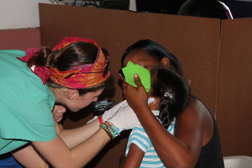 Physician Assistant students treating child