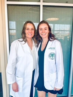 Assistant Professor Elizabeth Wylie and Natasha Brooks pose at the UAB PT White Coat Ceremony