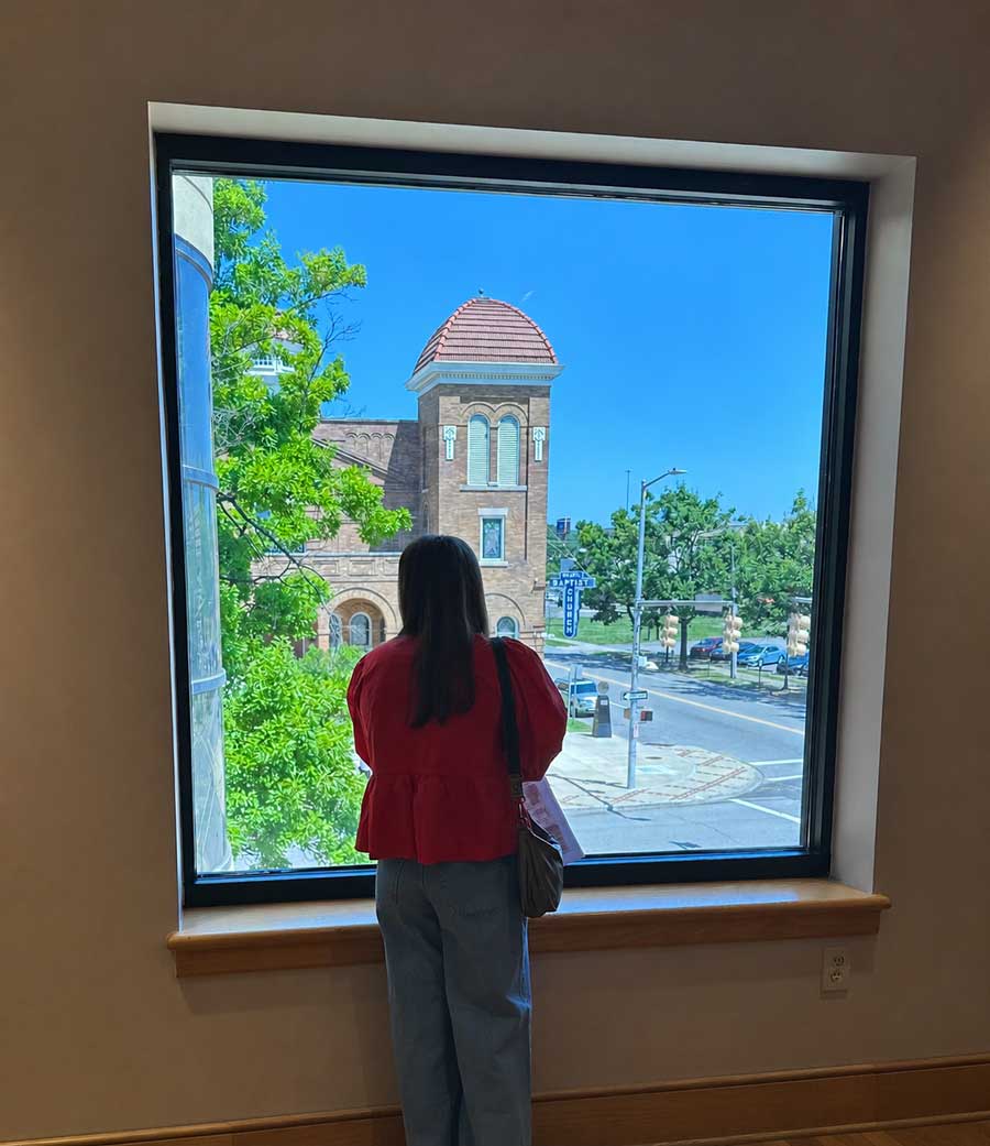 A student views the 16th Street Baptist Church from inside the BCRI. The church, organized in 1873, is an enduring symbol of the Civil Rights movement.
