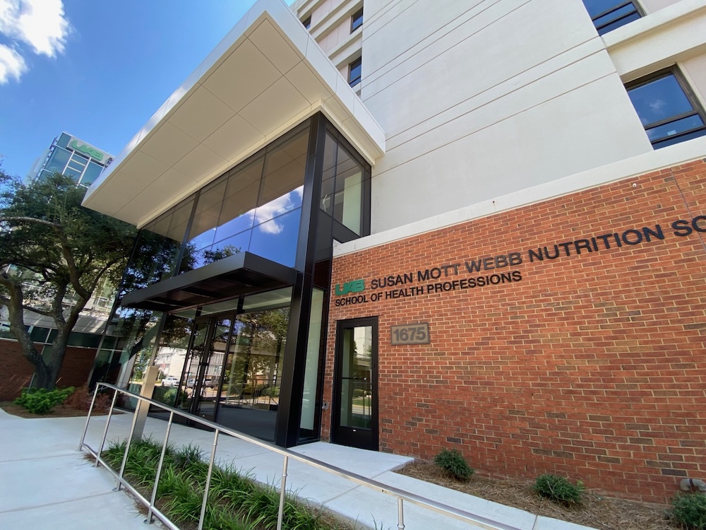Facade of Webb building shows beautiful glass entry way.