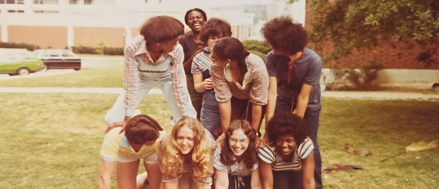 Students from the 1970s building a human pyramid.