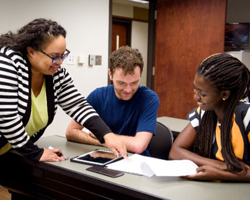 Students in the Biostatistics Student Organization looking over papers