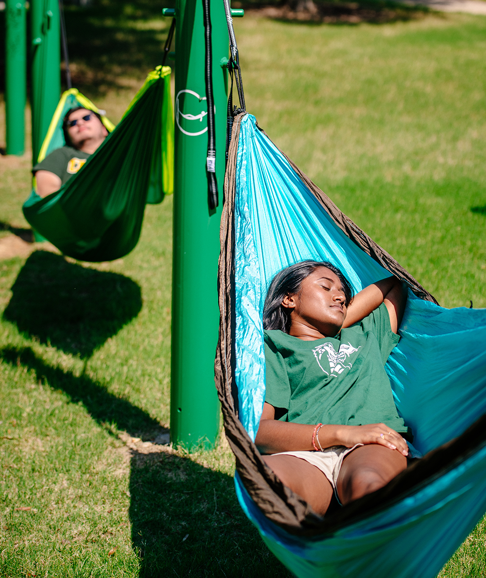 student lounging in hammock