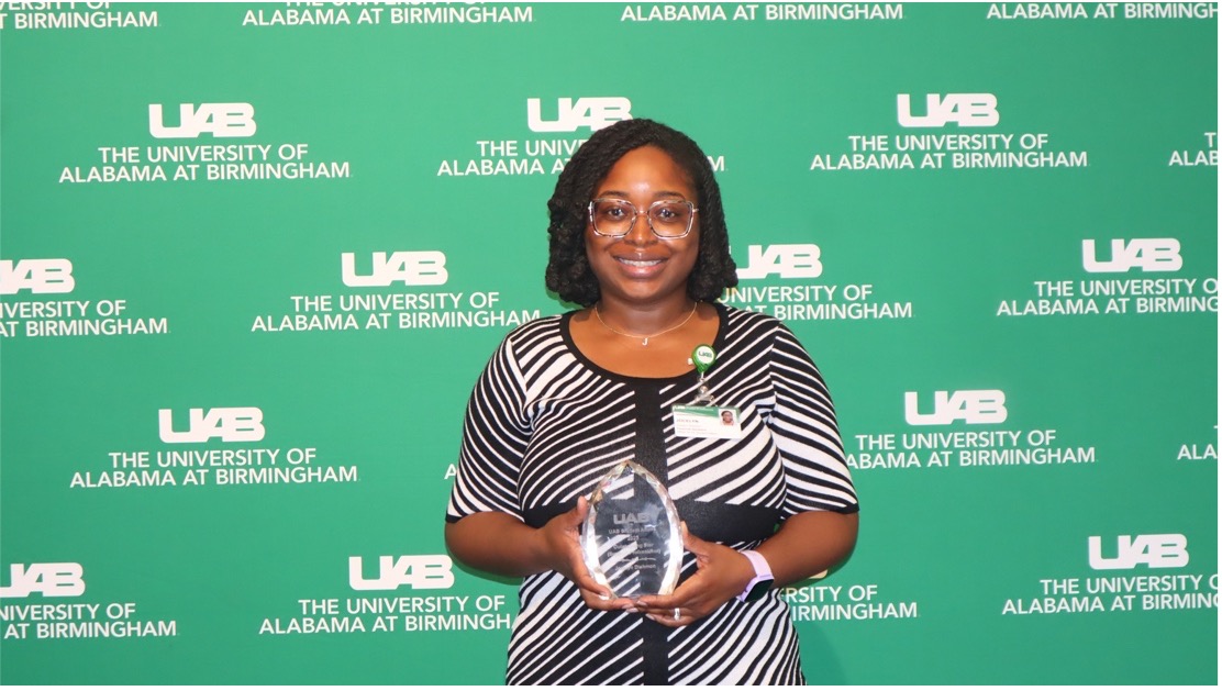 Jocelyn Dishmon with the Outstanding Star Administrative Support Professional award at 2025 End of the Year Luncheon